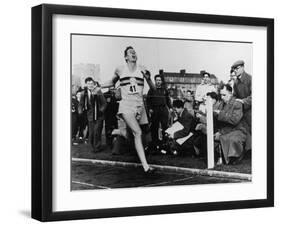 R. Bannister Runs Mile-null-Framed Premium Photographic Print