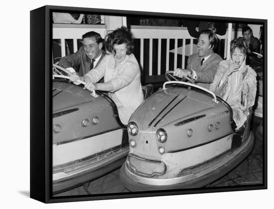 Racing Drivers Graham Hill and Jim Clark Enjoying a Dodgem Ride-null-Framed Stretched Canvas