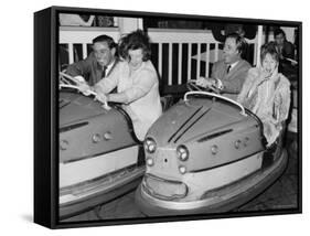 Racing Drivers Graham Hill and Jim Clark Enjoying a Dodgem Ride-null-Framed Stretched Canvas