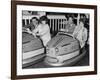 Racing Drivers Graham Hill and Jim Clark Enjoying a Dodgem Ride-null-Framed Photographic Print