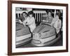 Racing Drivers Graham Hill and Jim Clark Enjoying a Dodgem Ride-null-Framed Photographic Print