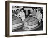 Racing Drivers Graham Hill and Jim Clark Enjoying a Dodgem Ride-null-Framed Photographic Print