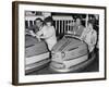 Racing Drivers Graham Hill and Jim Clark Enjoying a Dodgem Ride-null-Framed Photographic Print