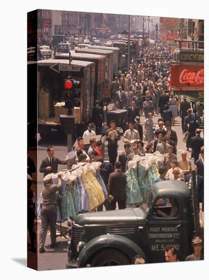 Racks of Dresses Steered by Pushboys Along Crowded Sidewalks in Garment District-null-Stretched Canvas