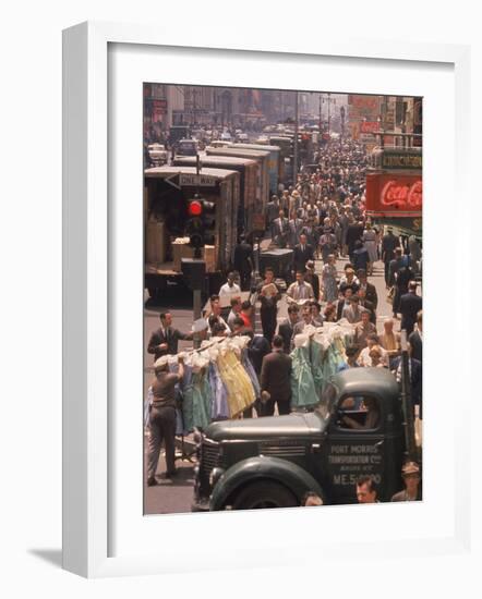 Racks of Dresses Steered by Pushboys Along Crowded Sidewalks in Garment District-null-Framed Photographic Print
