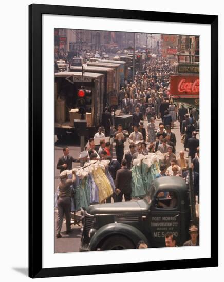 Racks of Dresses Steered by Pushboys Along Crowded Sidewalks in Garment District-null-Framed Photographic Print