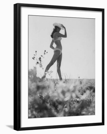 Racquel Welch Sporting a White Cowboy Hat While Posing in a Bikini-null-Framed Premium Photographic Print