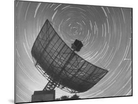 Radio Telescope Listening to Sound from Space as Visible Stars Circle Sky Forming Streaks of Light-Fritz Goro-Mounted Photographic Print