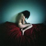 A Young Woman Sat on a Red Bed Sheet-Rafal Bednarz-Photographic Print