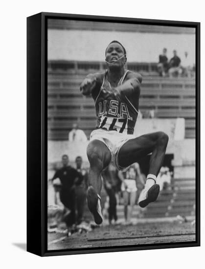 Rafer Johnson in Decathlon Broad Jump in Olympics-James Whitmore-Framed Stretched Canvas