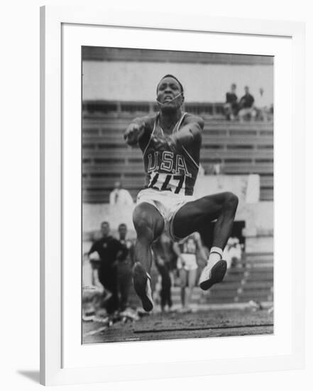 Rafer Johnson in Decathlon Broad Jump in Olympics-James Whitmore-Framed Premium Photographic Print