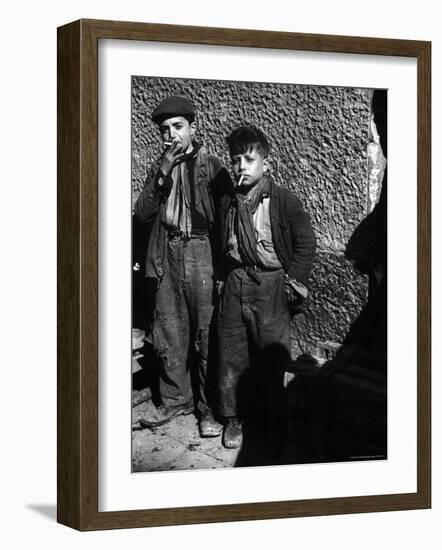 Ragged, Filthy, Poverty Stricken, Street Boys Smoking Cigarettes Begged from American Soldiers-George Rodger-Framed Photographic Print