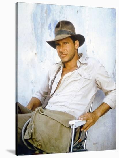 RAIDERS OF THE LOST ARK, 1981 On the set, Harrison Ford (photo)-null-Stretched Canvas