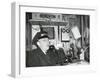 Railroad Conductor Uses an on Board Telephone to Communicate with Other Parts of the Train-null-Framed Photo