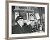 Railroad Conductor Uses an on Board Telephone to Communicate with Other Parts of the Train-null-Framed Photo