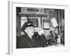 Railroad Conductor Uses an on Board Telephone to Communicate with Other Parts of the Train-null-Framed Photo