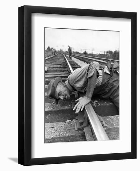 Railroad Section Boss D. D. Pittman Checking to Make Sure New Rail is properly level-Alfred Eisenstaedt-Framed Photographic Print