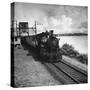 Railroad Train Following Tracks Beside Panama Canal-Thomas D^ Mcavoy-Stretched Canvas
