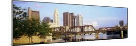 Railway bridge across a river with skyscrapers in the background, Scioto River, Columbus, Ohio, USA-null-Mounted Photographic Print