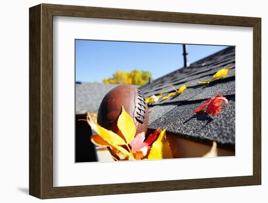 Rain Gutter Full of Autumn Leaves with a Football-soupstock-Framed Photographic Print