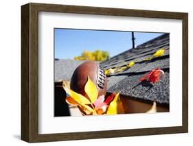 Rain Gutter Full of Autumn Leaves with a Football-soupstock-Framed Photographic Print