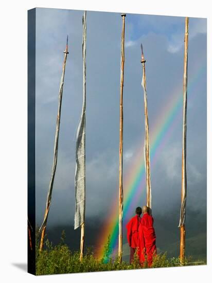 Rainbow and Monks with Praying Flags, Phobjikha Valley, Gangtey Village, Bhutan-Keren Su-Stretched Canvas