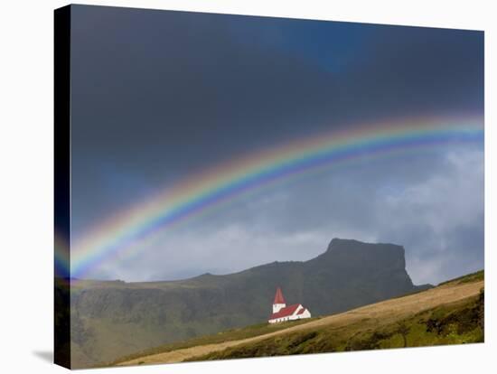 Rainbow over Church, Vik, Iceland-Peter Adams-Stretched Canvas