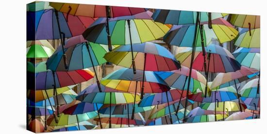 Rainbow umbrellas, Bucharest, Romania-Art Wolfe Wolfe-Stretched Canvas