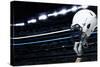 Raised Football Helmet at an American Football Stadium-yobro-Stretched Canvas