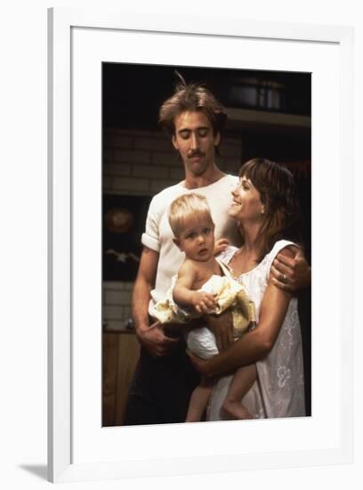 RAISIN ARIZONA, 1987 directed by JOEL AND ETHAN COEN Nicolas Cage and Holly Hunter (photo)-null-Framed Photo