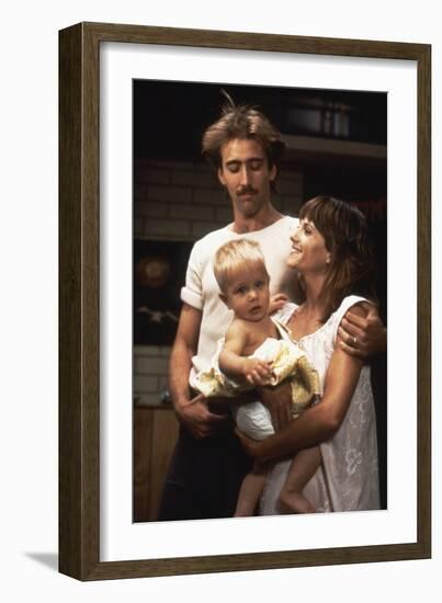 RAISIN ARIZONA, 1987 directed by JOEL AND ETHAN COEN Nicolas Cage and Holly Hunter (photo)-null-Framed Photo