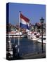 Raising the Dutch Flag by the Harbour, Volendam, Ijsselmeer, Holland-I Vanderharst-Stretched Canvas