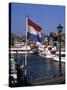 Raising the Dutch Flag by the Harbour, Volendam, Ijsselmeer, Holland-I Vanderharst-Stretched Canvas