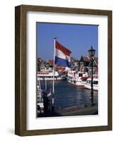 Raising the Dutch Flag by the Harbour, Volendam, Ijsselmeer, Holland-I Vanderharst-Framed Photographic Print