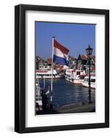 Raising the Dutch Flag by the Harbour, Volendam, Ijsselmeer, Holland-I Vanderharst-Framed Photographic Print