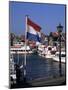 Raising the Dutch Flag by the Harbour, Volendam, Ijsselmeer, Holland-I Vanderharst-Mounted Photographic Print