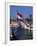 Raising the Dutch Flag by the Harbour, Volendam, Ijsselmeer, Holland-I Vanderharst-Framed Photographic Print