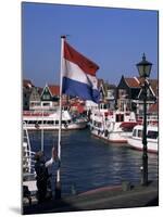 Raising the Dutch Flag by the Harbour, Volendam, Ijsselmeer, Holland-I Vanderharst-Mounted Photographic Print