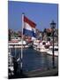 Raising the Dutch Flag by the Harbour, Volendam, Ijsselmeer, Holland-I Vanderharst-Mounted Photographic Print