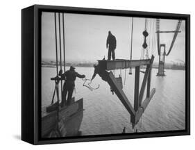 Raising the Truss, Men of the Raising Gang Ride the Swinging Steel 160 Feet Above the Water-Peter Stackpole-Framed Stretched Canvas