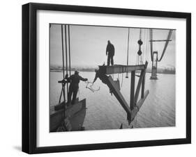 Raising the Truss, Men of the Raising Gang Ride the Swinging Steel 160 Feet Above the Water-Peter Stackpole-Framed Photographic Print