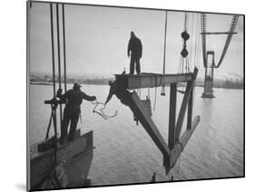 Raising the Truss, Men of the Raising Gang Ride the Swinging Steel 160 Feet Above the Water-Peter Stackpole-Mounted Photographic Print