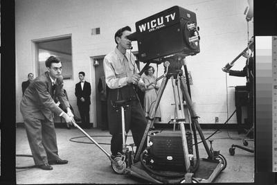 Cameraman Nick Luppino Honing in TV Camera During 1st Broadcast at Newly Opened WICV-TV Station