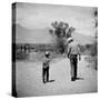 Rancher James A. Shugart Walking a Dusty Road with Son James Jr-Allan Grant-Stretched Canvas