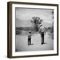 Rancher James A. Shugart Walking a Dusty Road with Son James Jr-Allan Grant-Framed Photographic Print