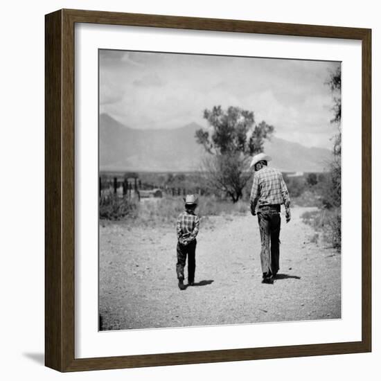 Rancher James A. Shugart Walking a Dusty Road with Son James Jr-Allan Grant-Framed Photographic Print