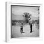 Rancher James A. Shugart Walking a Dusty Road with Son James Jr-Allan Grant-Framed Photographic Print