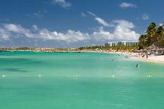 Vacationers along Palm Beach in Aruba-raphoto-Framed Stretched Canvas