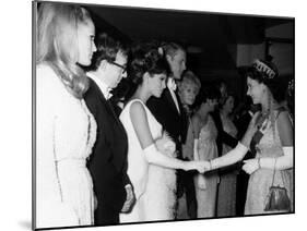 Raquel Welch Meets Queen Elizabeth in 1966 with Woody Allen and Ursula Andress-null-Mounted Photographic Print