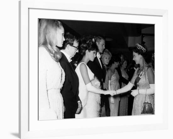 Raquel Welch Meets Queen Elizabeth in 1966 with Woody Allen and Ursula Andress-null-Framed Photographic Print